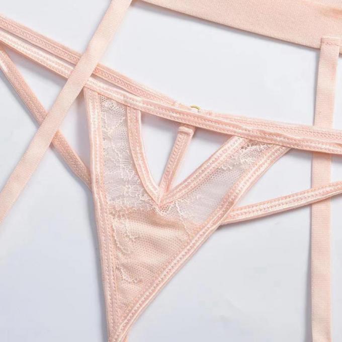 I reggiseni e le mutandine sexy hanno messo la cavità che della biancheria intima le mutandine sexy hanno messo l'abbigliamento del corpo per la biancheria del sesso