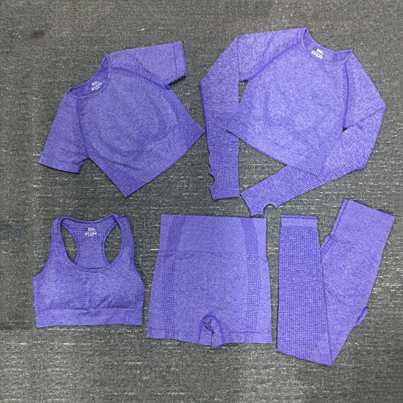 L'elastam di nylon del poliestere ha potato gli abiti sportivi costolati della manica di allenamento di usura superiore lunga della palestra